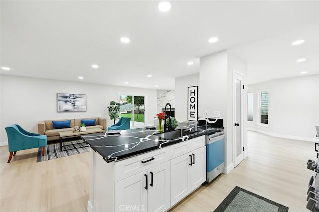6304 Pablo Ct, Chino, CA 91710 - kitchen with dishwashing machine, a peninsula, dark countertops, light wood finished floors, and white cabinets