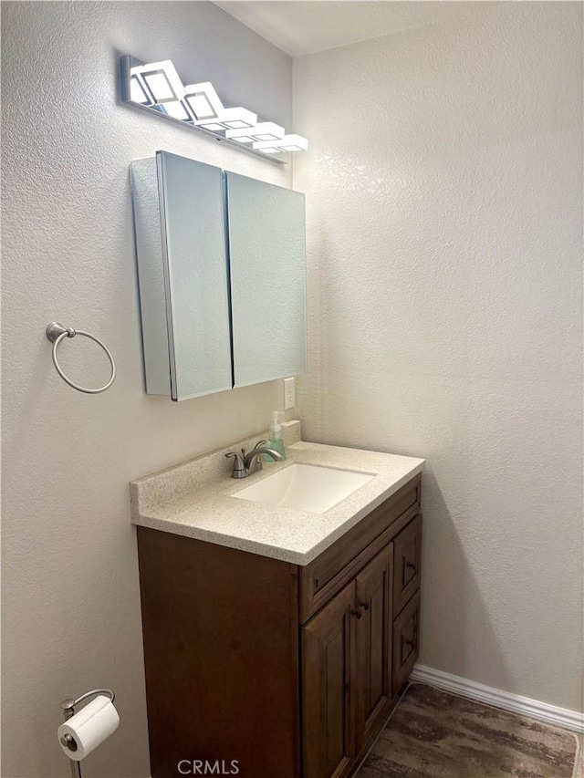 9856 Hawthorne Ave, Hesperia, CA 92345 - bathroom with vanity and wood finished floors