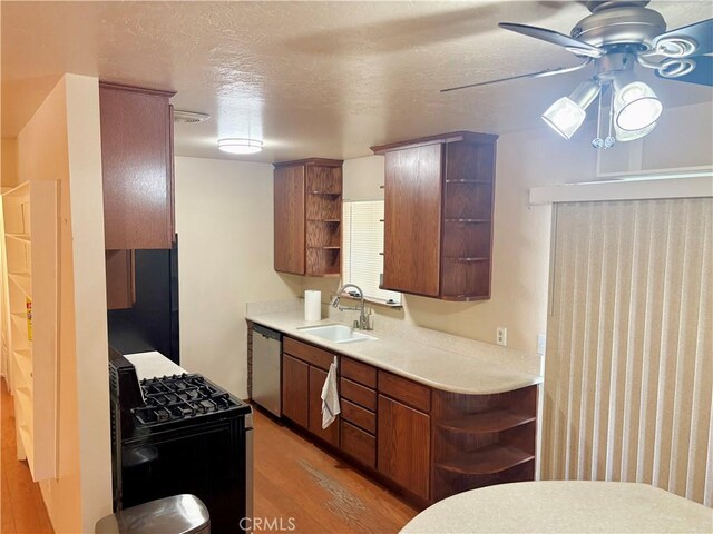 9856 Hawthorne Ave, Hesperia, CA 92345 - kitchen with open shelves, black appliances, a ceiling fan, light wood-type flooring, and light countertops