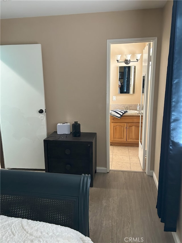 826 Railroad St, Corona, CA 92882 - bedroom with light wood finished floors and ensuite bathroom