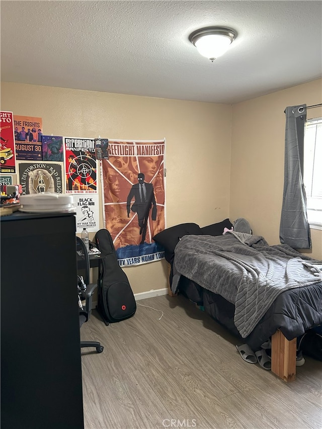 826 Railroad St, Corona, CA 92882 - bedroom with wood finished floors and a textured ceiling