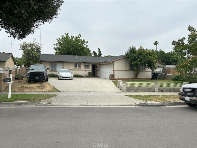 826 Railroad St, Corona, CA 92882 - ranch-style house with concrete driveway, a garage, and a fenced front yard