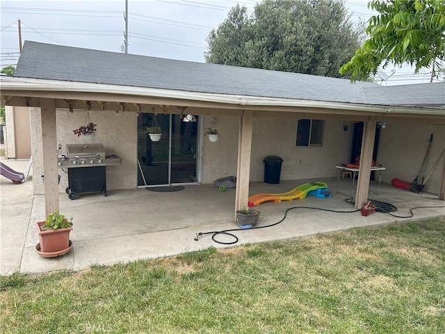 826 Railroad St, Corona, CA 92882 - back of property with stucco siding, a patio area, and roof with shingles