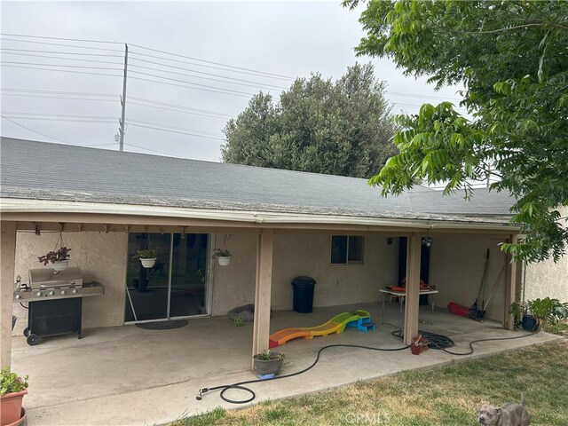 826 Railroad St, Corona, CA 92882 - rear view of property with stucco siding, a patio area, and a shingled roof