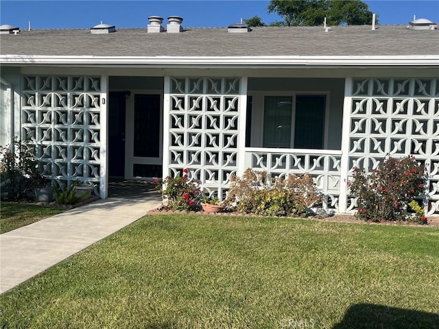 13821 Fresh Meadow Ln Unit M3-D, Seal Beach, CA 90740 - property entrance with a lawn, a porch, and roof with shingles
