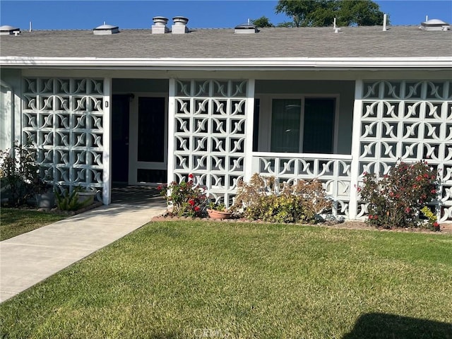 13821 Fresh Meadow Ln Unit M3-D, Seal Beach, CA 90740 - entrance to property featuring a lawn, a porch, and roof with shingles
