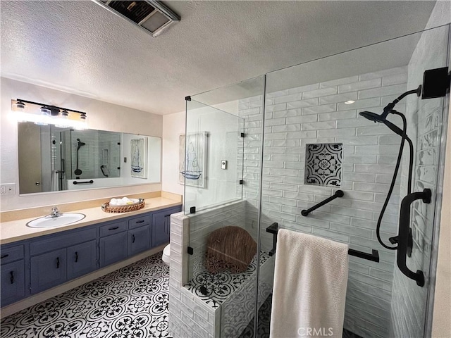 13821 Fresh Meadow Ln Unit M3-D, Seal Beach, CA 90740 - full bathroom with vanity, a stall shower, and a textured ceiling