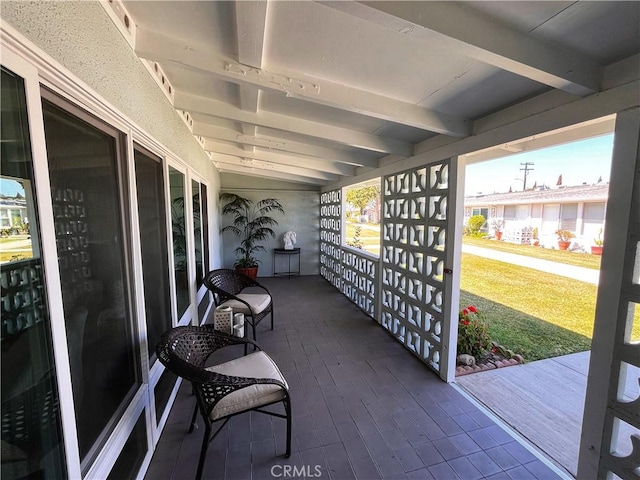 13821 Fresh Meadow Ln Unit M3-D, Seal Beach, CA 90740 - sunroom featuring beamed ceiling