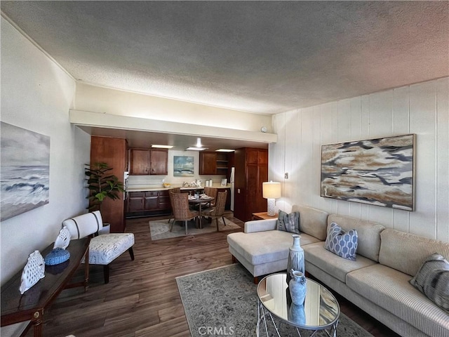 13821 Fresh Meadow Ln Unit M3-D, Seal Beach, CA 90740 - living room with dark wood-style flooring and a textured ceiling