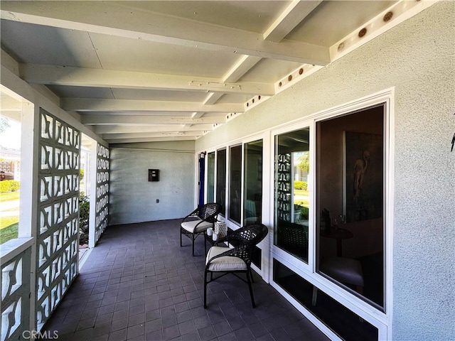 13821 Fresh Meadow Ln Unit M3-D, Seal Beach, CA 90740 - sunroom with healthy amount of natural light and beamed ceiling