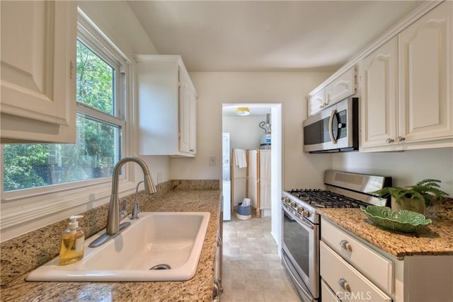 252 E Scenic Dr, Monrovia, CA 91016 - kitchen featuring appliances with stainless steel finishes, white cabinetry, and light stone countertops