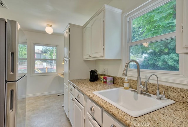252 E Scenic Dr, Monrovia, CA 91016 - kitchen with stainless steel fridge and white cabinetry