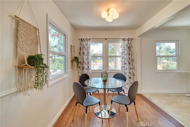 252 E Scenic Dr, Monrovia, CA 91016 - dining area with healthy amount of natural light, wood finished floors, and a chandelier