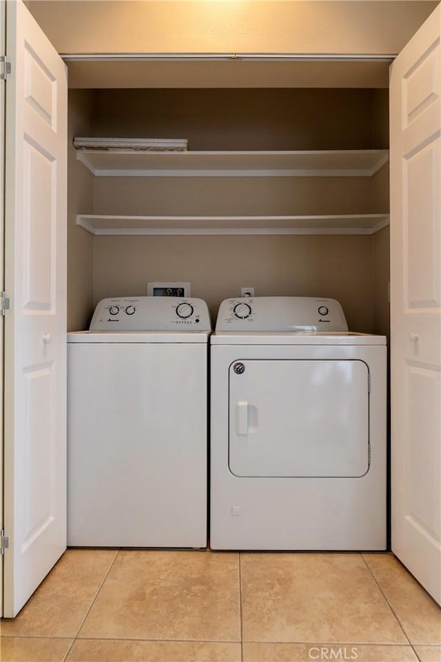 54 Los Cabos, Dana Point, CA 92629 - laundry room with washing machine and clothes dryer and light tile patterned floors