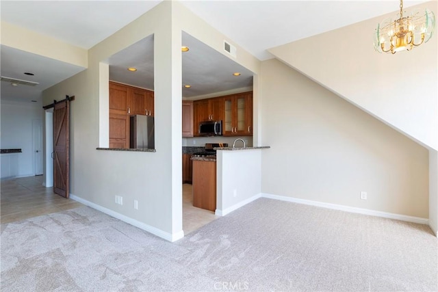 54 Los Cabos, Dana Point, CA 92629 - kitchen with stainless steel appliances, light colored carpet, brown cabinetry, recessed lighting, and glass insert cabinets