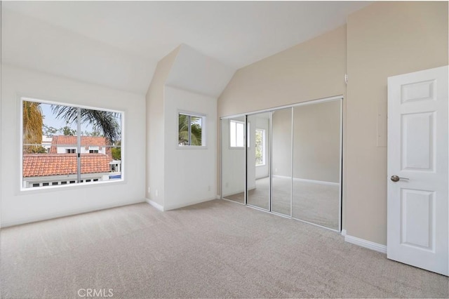 54 Los Cabos, Dana Point, CA 92629 - unfurnished bedroom featuring carpet flooring, lofted ceiling, and a closet