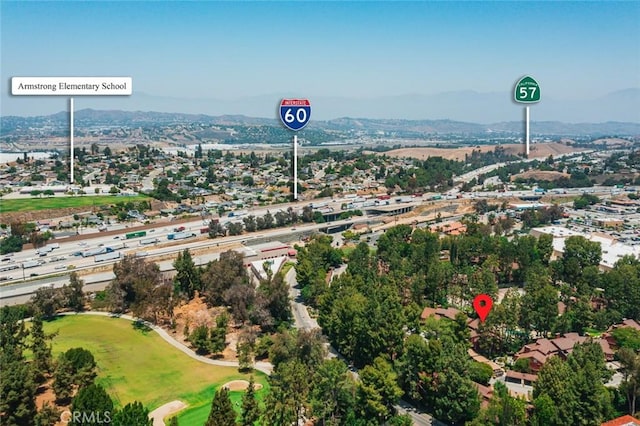 394 S Prospectors Rd Unit 102, Diamond Bar, CA 91765 - drone / aerial view of a mountain backdrop and a golf club