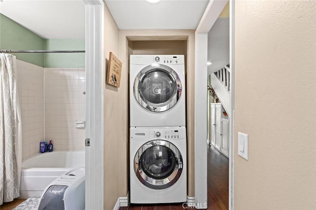 394 S Prospectors Rd Unit 102, Diamond Bar, CA 91765 - laundry room featuring stacked washer / drying machine and wood finished floors