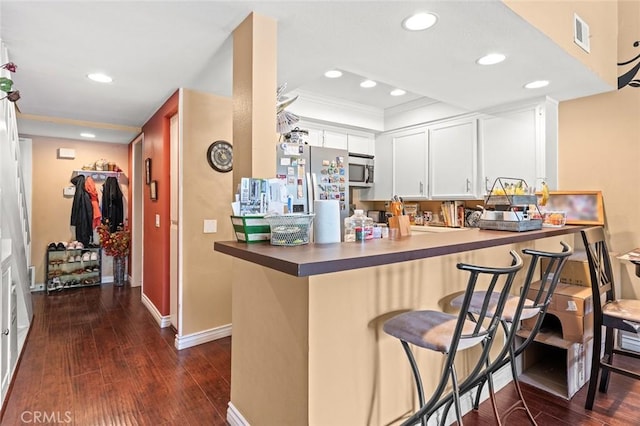 394 S Prospectors Rd Unit 102, Diamond Bar, CA 91765 - kitchen with stainless steel appliances, dark wood-style floors, recessed lighting, crown molding, and a peninsula