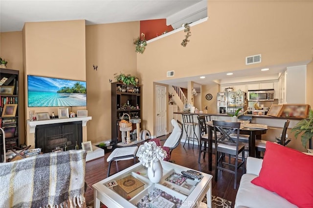 394 S Prospectors Rd Unit 102, Diamond Bar, CA 91765 - living area with wood finished floors, a fireplace, and high vaulted ceiling