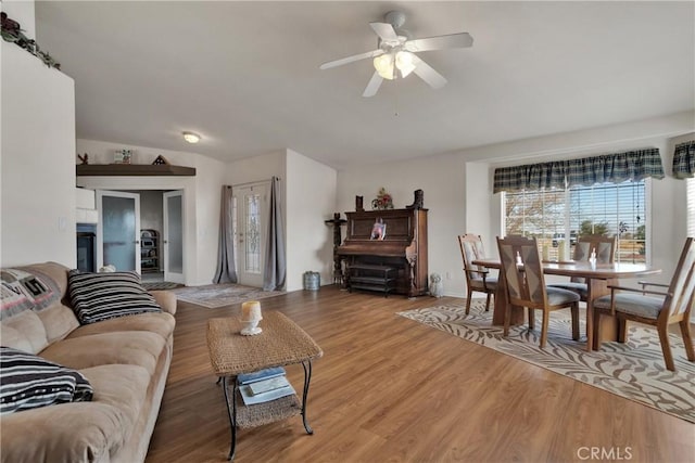 10776 Joshua St, Oak Hills, CA 92344 - living area featuring ceiling fan, light wood-style floors, and vaulted ceiling