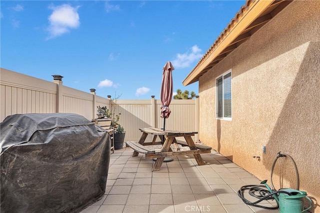 10776 Joshua St, Oak Hills, CA 92344 - fenced backyard featuring a patio and a grill