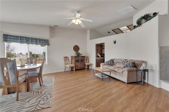 10776 Joshua St, Oak Hills, CA 92344 - living area featuring light wood-style flooring, a ceiling fan, and high vaulted ceiling