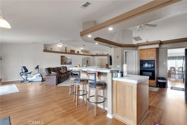 10776 Joshua St, Oak Hills, CA 92344 - kitchen featuring ceiling fan, light wood-type flooring, recessed lighting, light countertops, and vaulted ceiling