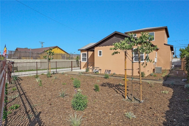 3032 Cogswell Rd, El Monte, CA 91732 - rear view of house with stucco siding and a fenced backyard