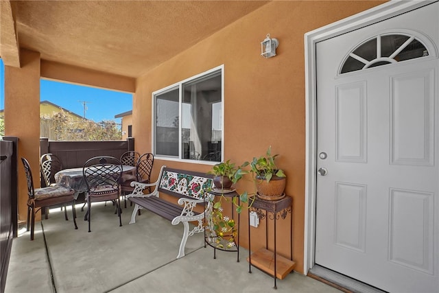 3032 Cogswell Rd, El Monte, CA 91732 - entrance to property with stucco siding and outdoor dining area