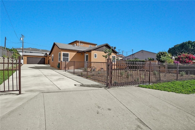 3032 Cogswell Rd, El Monte, CA 91732 - view of front facade with concrete driveway, stucco siding, and a residential view