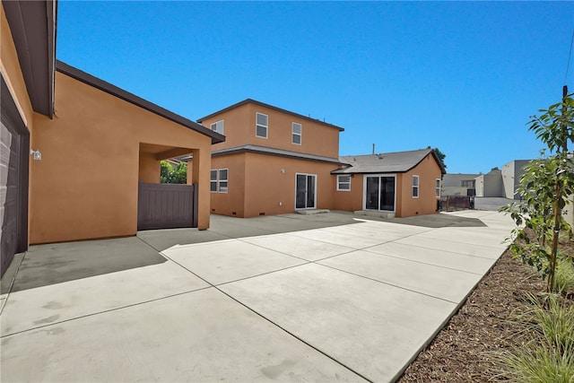 3032 Cogswell Rd, El Monte, CA 91732 - rear view of property with stucco siding and a patio