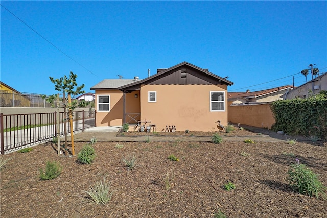 3032 Cogswell Rd, El Monte, CA 91732 - rear view of property with stucco siding, a fenced backyard, and a patio