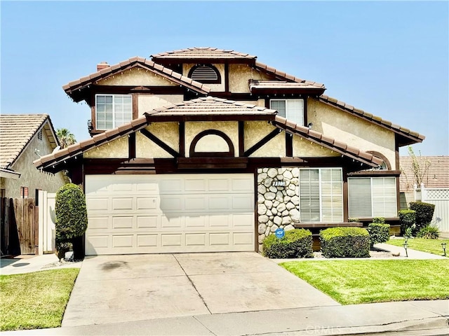 11308 Sherwood Ct, Fontana, CA 92337 - view of front of house with concrete driveway, a garage, a tile roof, stucco siding, and stone siding