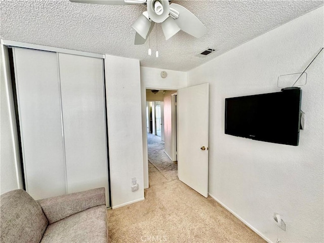 11308 Sherwood Ct, Fontana, CA 92337 - unfurnished room with light carpet, a ceiling fan, and a textured ceiling