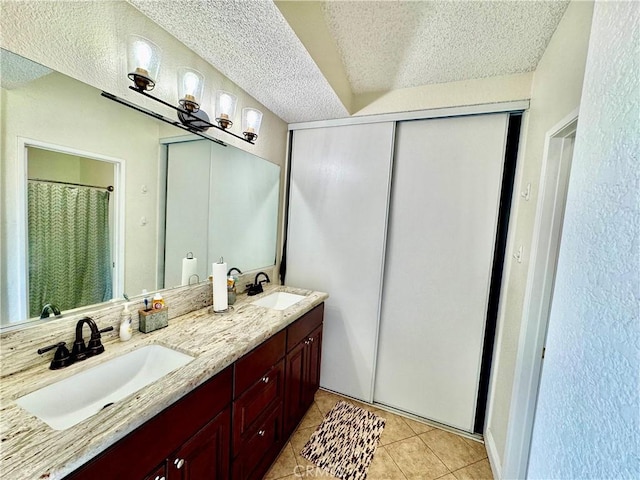 11308 Sherwood Ct, Fontana, CA 92337 - full bath with double vanity, tile patterned flooring, a textured ceiling, and a shower with curtain