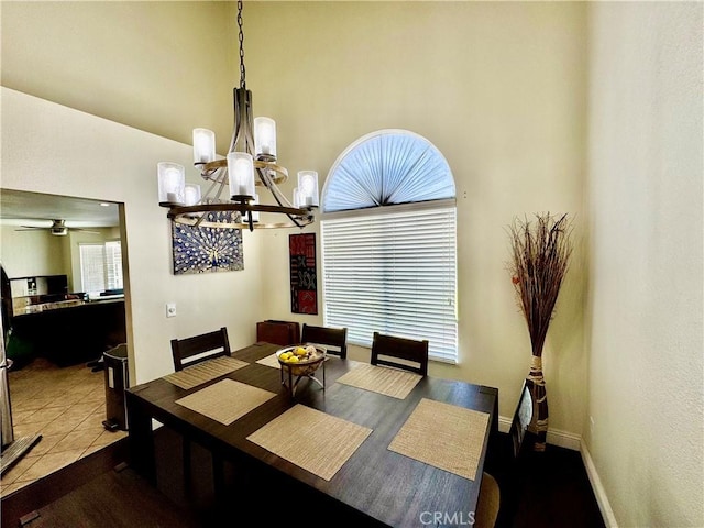 11308 Sherwood Ct, Fontana, CA 92337 - dining space featuring a chandelier and a towering ceiling