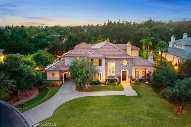 1109 Englemann Ct, Arcadia, CA 91006 - view of front facade featuring a chimney, stucco siding, a lawn, and stone siding