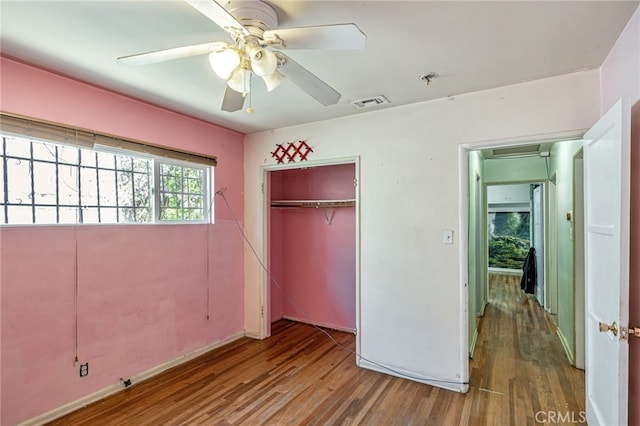 7134 Stansbury Ave, Van Nuys, CA 91405 - unfurnished bedroom with wood finished floors, a closet, and a ceiling fan