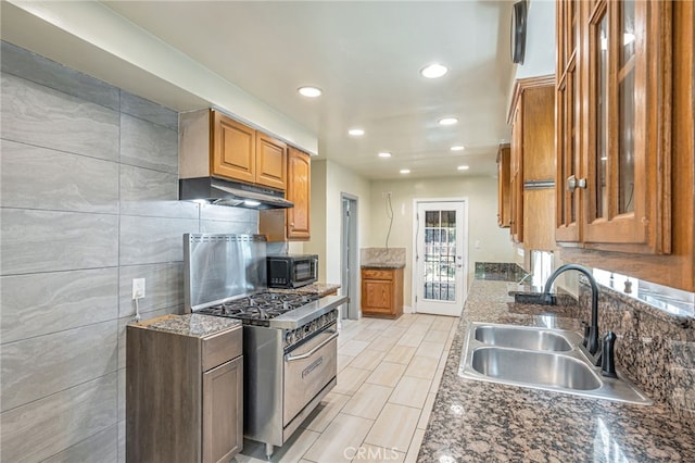 7134 Stansbury Ave, Van Nuys, CA 91405 - kitchen featuring stainless steel range, under cabinet range hood, black microwave, recessed lighting, and brown cabinetry