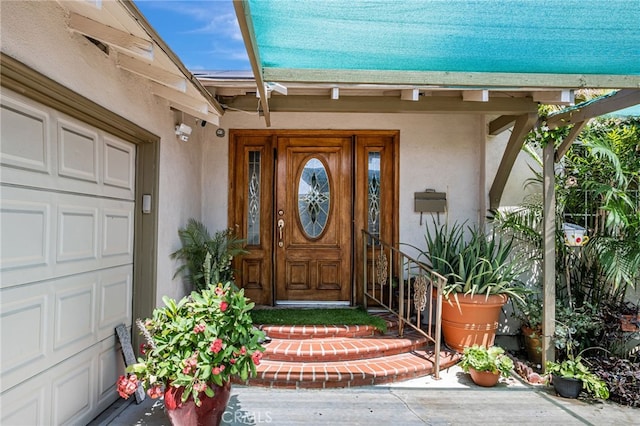 7134 Stansbury Ave, Van Nuys, CA 91405 - entrance to property featuring stucco siding and a garage