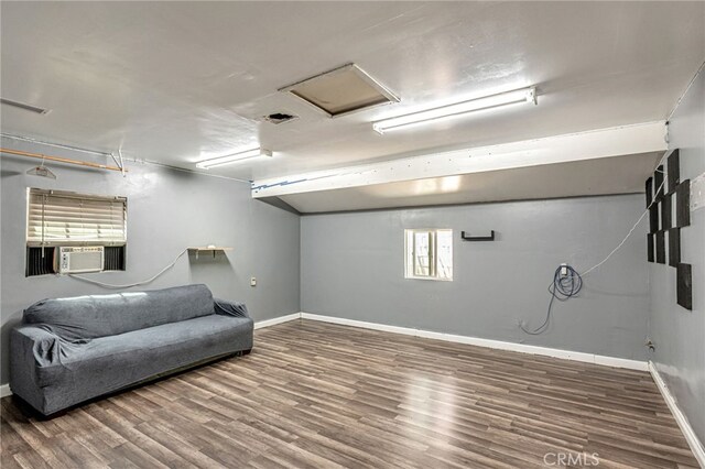 7134 Stansbury Ave, Van Nuys, CA 91405 - below grade area featuring wood finished floors and cooling unit