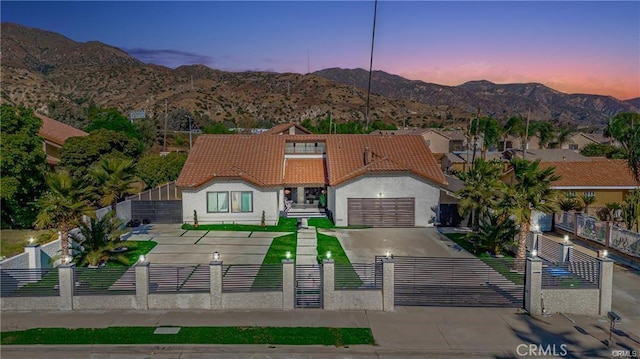 13800 Glenoaks Blvd, Sylmar, CA 91342 - view of front of property with a fenced front yard, a tile roof, stucco siding, and a mountain view