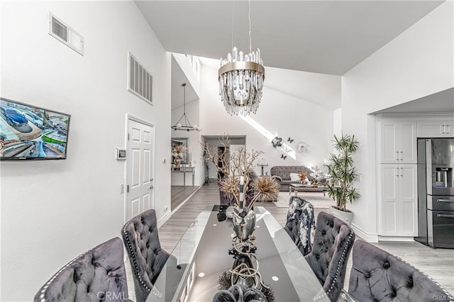 13800 Glenoaks Blvd, Sylmar, CA 91342 - dining space featuring a chandelier and light wood-type flooring