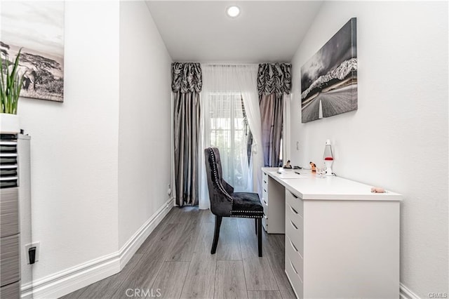 13800 Glenoaks Blvd, Sylmar, CA 91342 - office area with light wood-type flooring and a heating unit