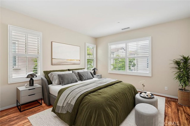72 Peony, Irvine, CA 92618 - bedroom featuring baseboards and wood finished floors