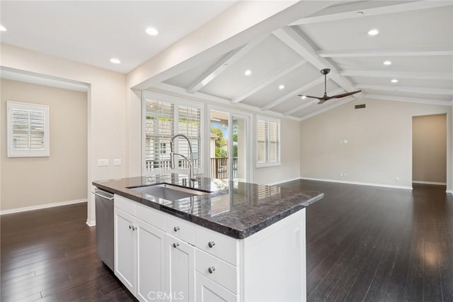 72 Peony, Irvine, CA 92618 - kitchen with dark wood-type flooring, stainless steel dishwasher, a center island with sink, recessed lighting, and white cabinetry