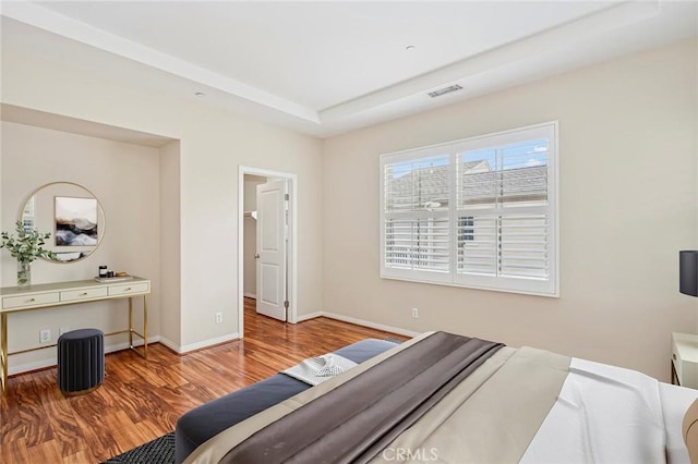 72 Peony, Irvine, CA 92618 - bedroom featuring wood finished floors and a raised ceiling