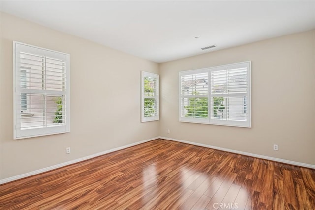 72 Peony, Irvine, CA 92618 - unfurnished room with wood finished floors and baseboards