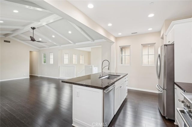 72 Peony, Irvine, CA 92618 - kitchen with stainless steel appliances, dark wood finished floors, an island with sink, white cabinetry, and recessed lighting